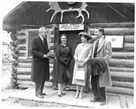 John and Olive Diefenbaker with Eric Nielson and his wife near the cabin of Sam McGee in Whitehor...