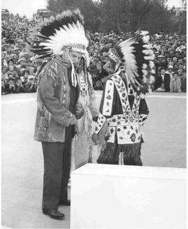 John Diefenbaker made honourary Chief Walking Buffalo by Chief William Little Crow at Outlook Sas...