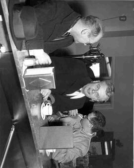 John Diefenbaker sitting at cafe counter