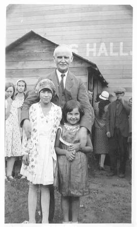 W.C. Murray posing with children
