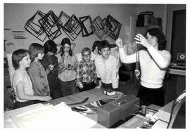 Pamela Buell leading a school tour group through the Diefenbaker Centre