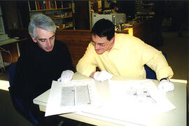 Peter Stoicheff and Andrew Taylor study a 13th-century Bible and missal songbook