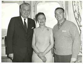 John and Olive Diefenbaker and cruise director on board a cruise ship