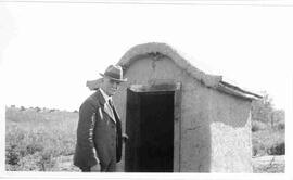 W.C. Murray looking in a shed