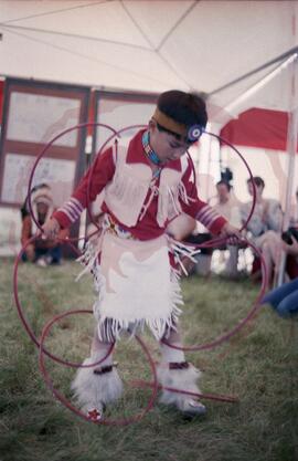 Child performing hoop dance