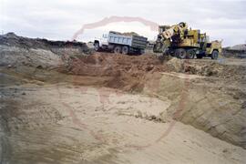 Dump truck being loaded up with soil