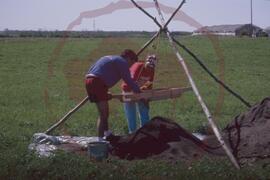 Field staff at work on sifting screen