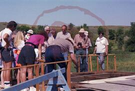 Visitors examining archaeological excavation site