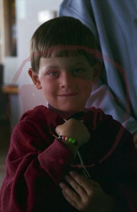 Child showing bead bracelet