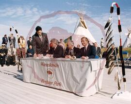 Prime Minister Brian Mulroney signing the agreement with Chief Roland Crowe and Premier Roy Romanow