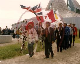 Ceremonial procession being led by sacred eagle staff