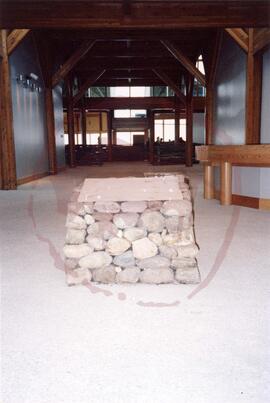 Front view of block made of stones in lobby near entrance