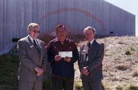 Frank Prosto and Ted Hanlon from Wascana presenting cheque to Senator Ernest Mike