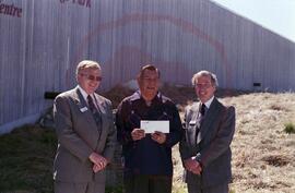 Frank Prosto and Ted Hanlon from Wascana presenting cheque to Senator Ernest Mike