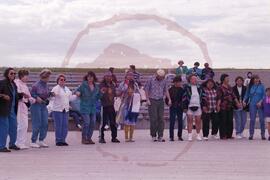 Visitors performing a round dance in amphitheatre