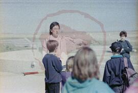 Park interpreter outside with group of children