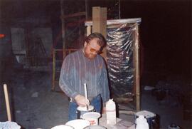 Person mixing paint