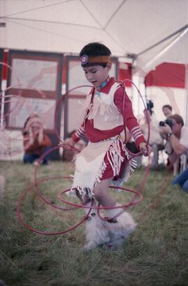 Child performing hoop dance