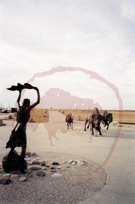 View of woman, bull, cow, and calf sculptures outside visitor centre