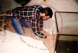Person installing glass case
