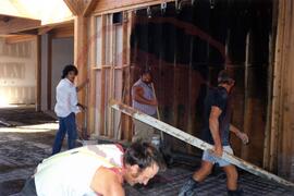 People pouring concrete flooring