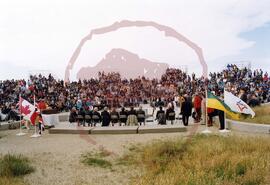 Distant view of audience, chiefs and dignitaries in amphitheatre