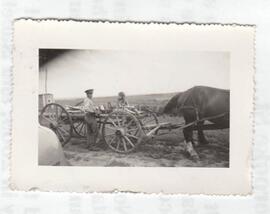 Farmer, daughter, horses & wagon